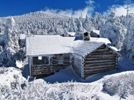 A snowy lodge in a mountain landscape