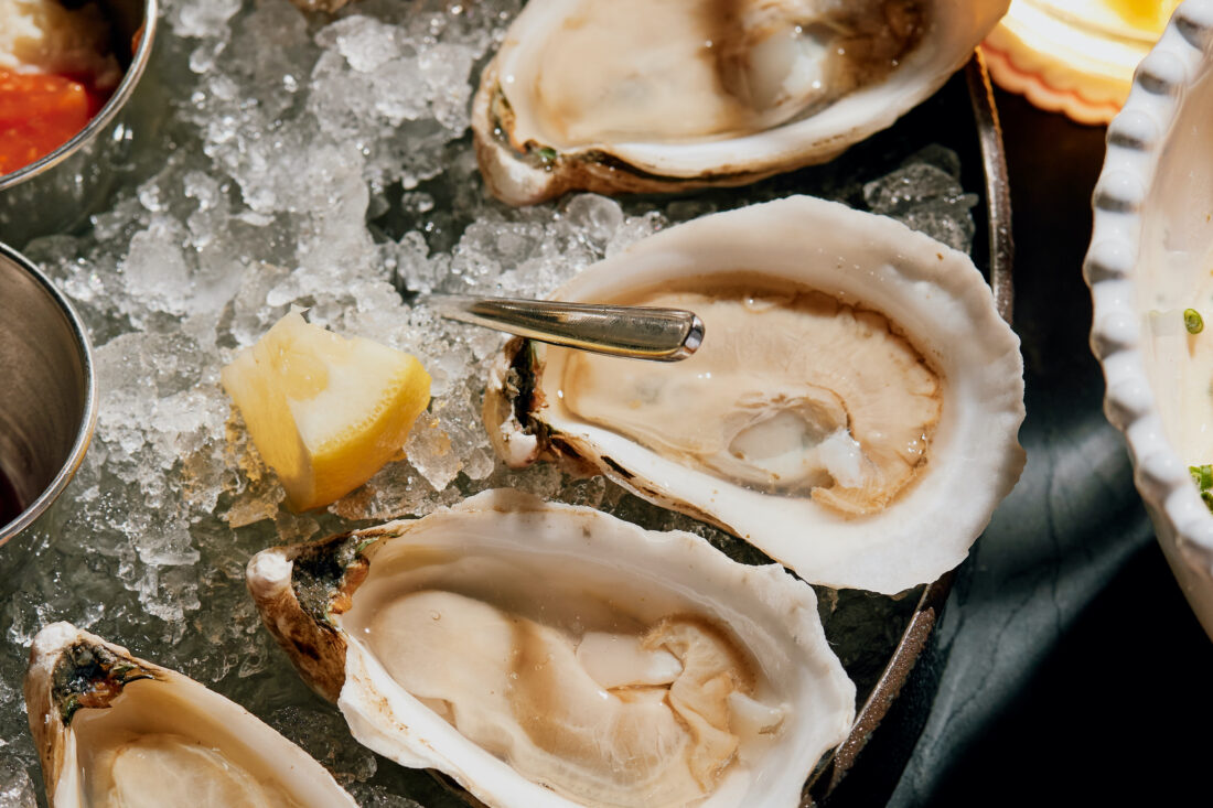 A plate of oysters on the half shell on ice