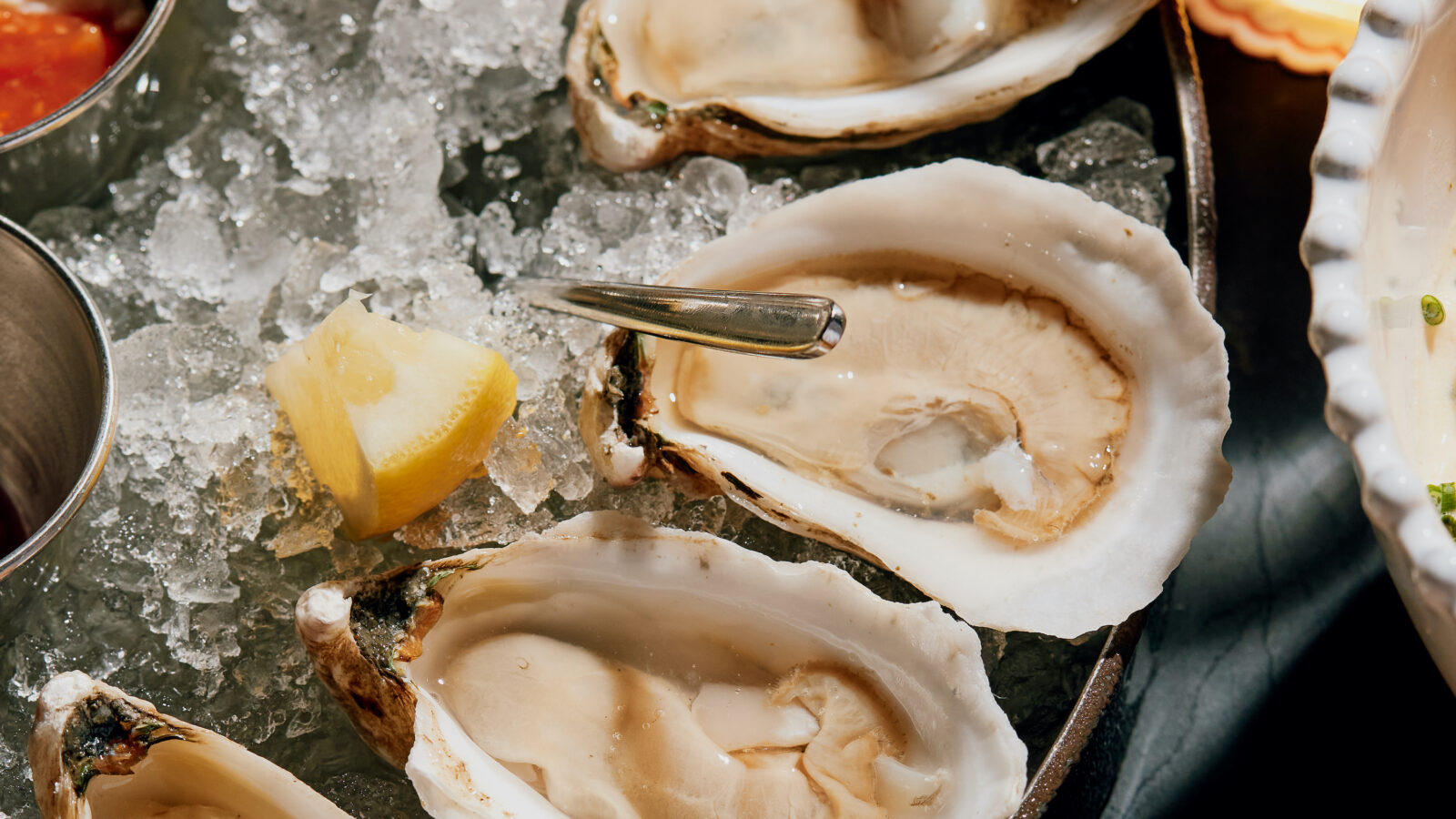A plate of oysters on the half shell on ice