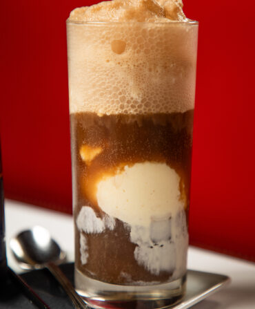 A tall glass of a root beer float