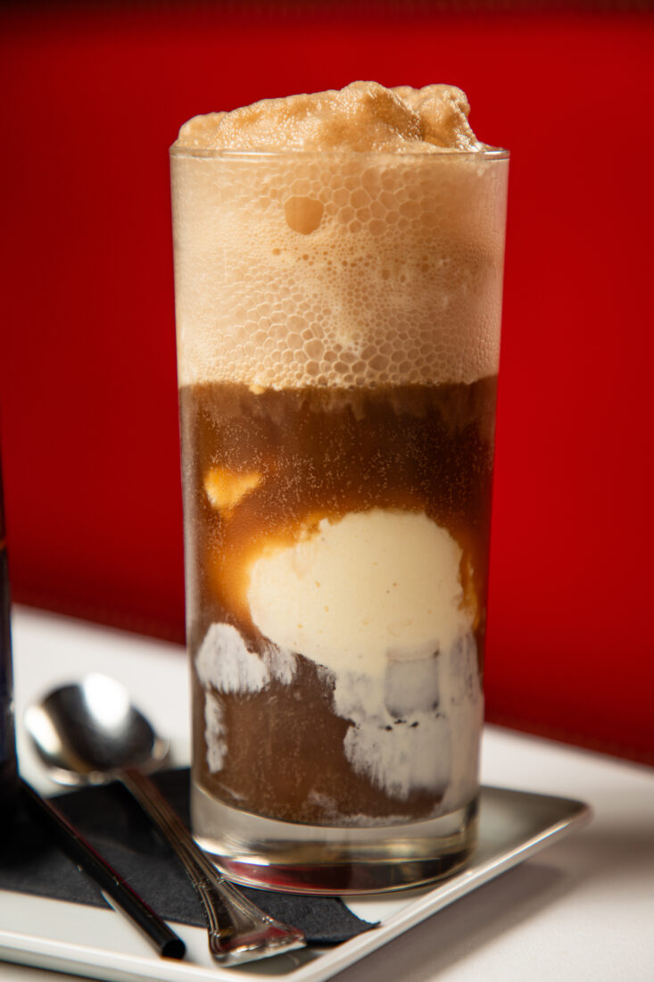 A tall glass of a root beer float