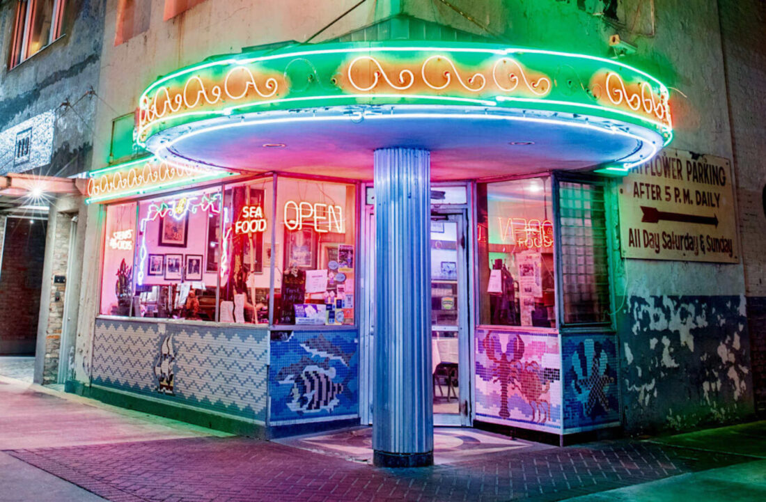Outside a cafe with neon signs