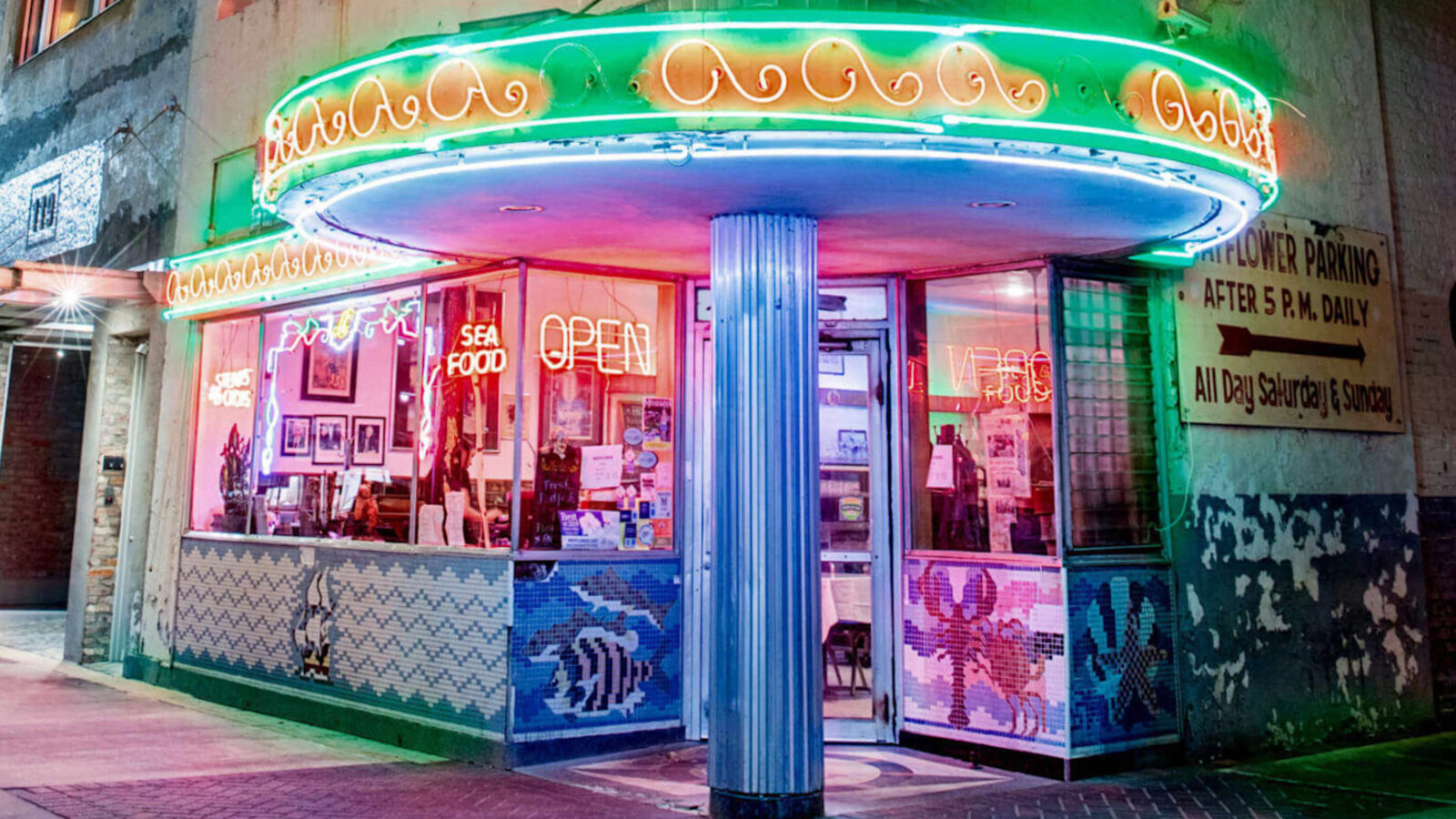 Outside a cafe with neon signs