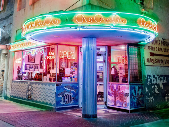 Outside a cafe with neon signs