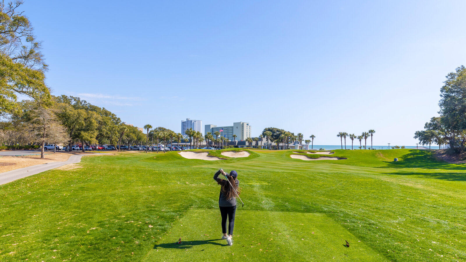 A woman playing golf