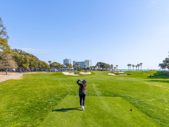 A woman playing golf