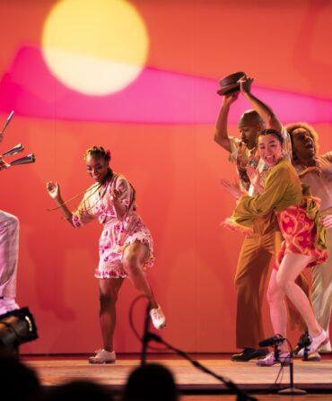 People dance on a stage