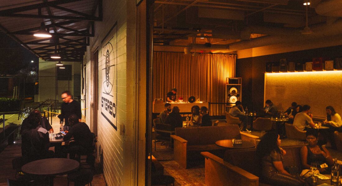 A listening bar with dark, warm lights and a moody feel