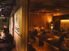 A listening bar with dark, warm lights and a moody feel