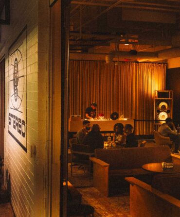 A listening bar with dark, warm lights and a moody feel