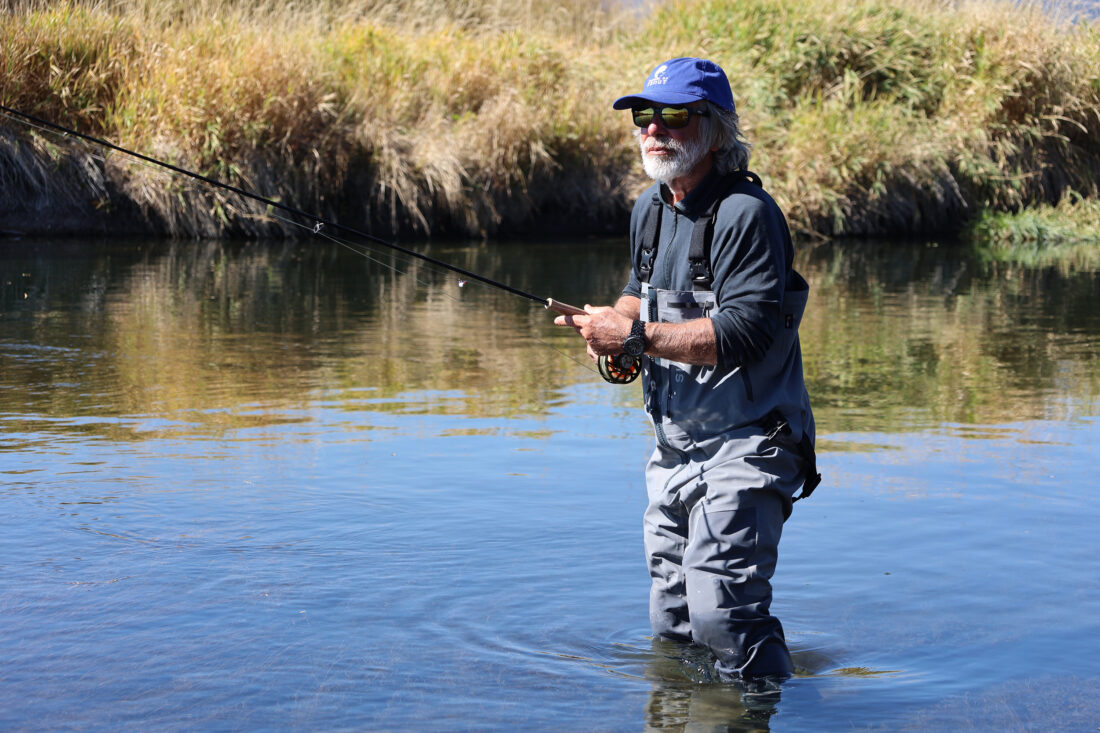 A man fishing in a river
