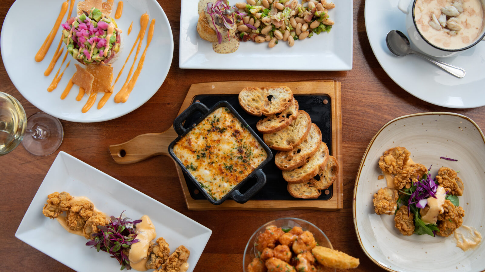 A spread of seafood plates on a table