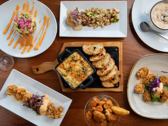 A spread of seafood plates on a table