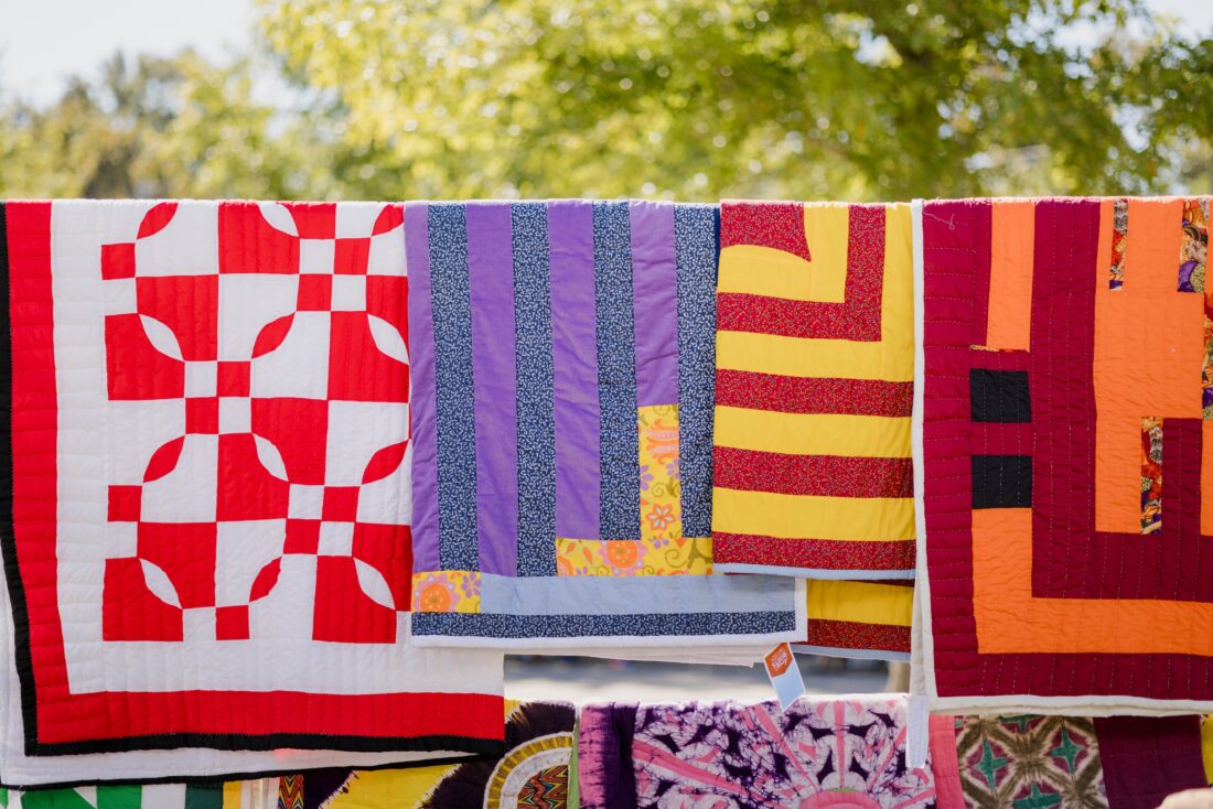 Quilts hanging on a clothesline