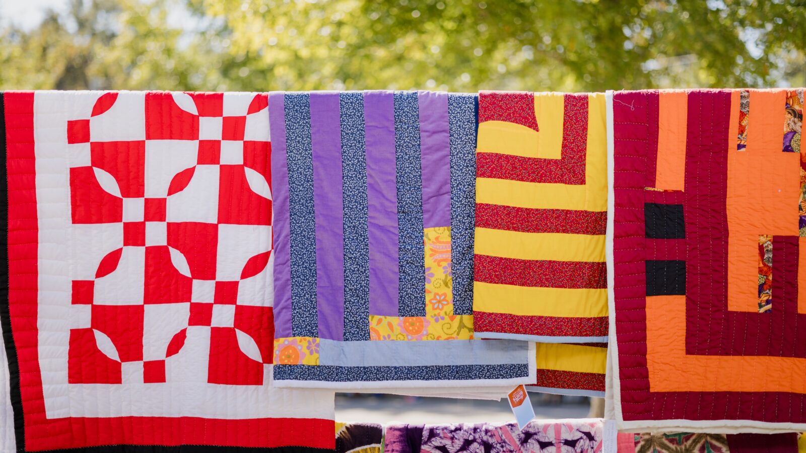 Quilts hanging on a clothesline