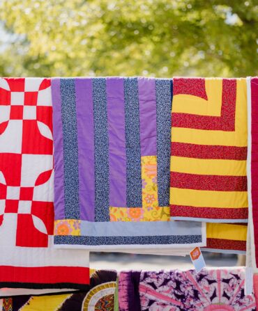 Quilts hanging on a clothesline