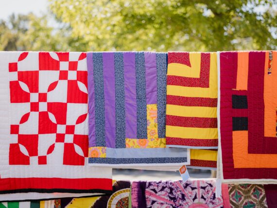 Quilts hanging on a clothesline
