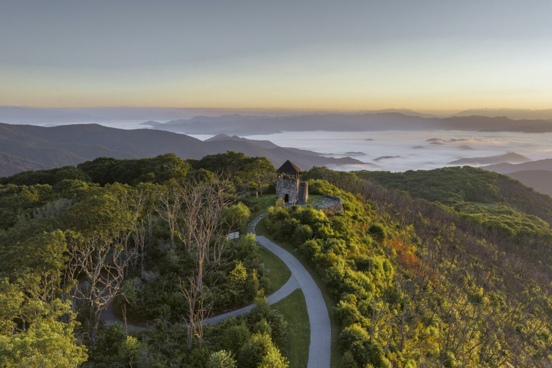 A lookout tower over a mountain landscape