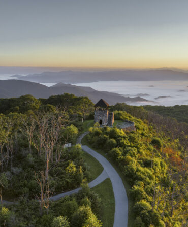 A lookout tower over a mountain landscape