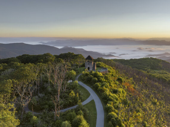 A lookout tower over a mountain landscape